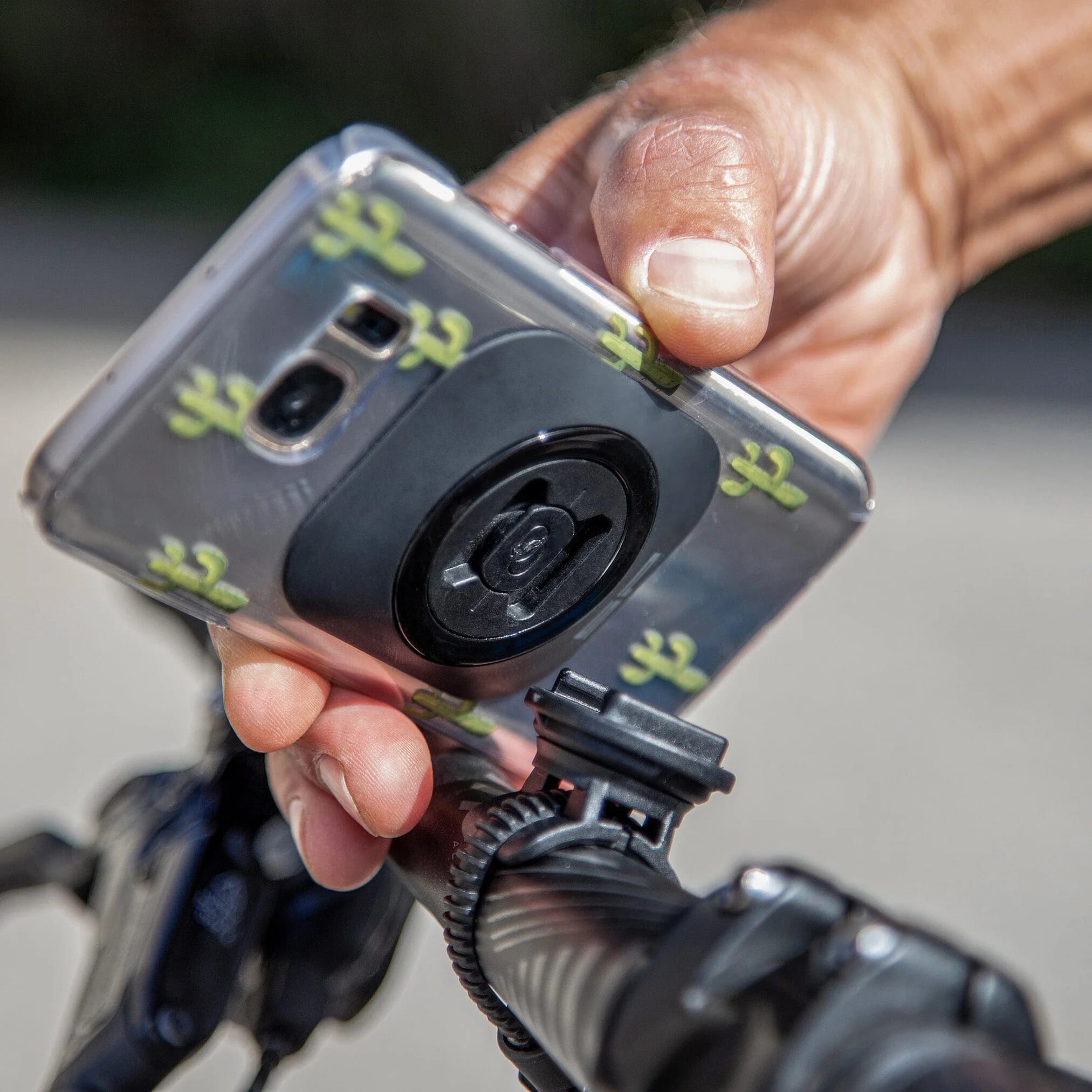 SP Connect Universal Interface adhesive mount - attached to mobile phone